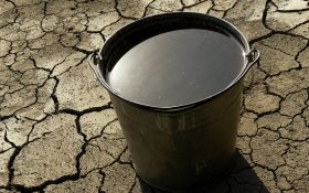 Bucket of water on dry soil - Stockholm World Water Week