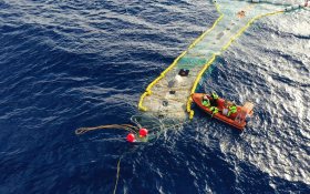 New garbage recovery system by The Ocean Cleanup deployed at sea.