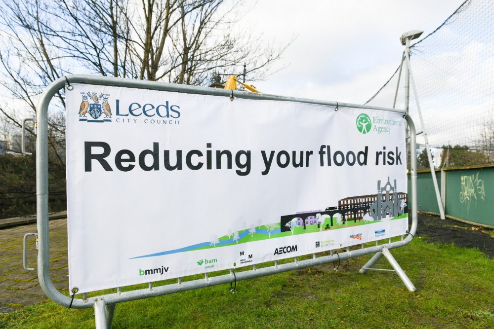 Construction sign along river Aire for Leeds flood scheme