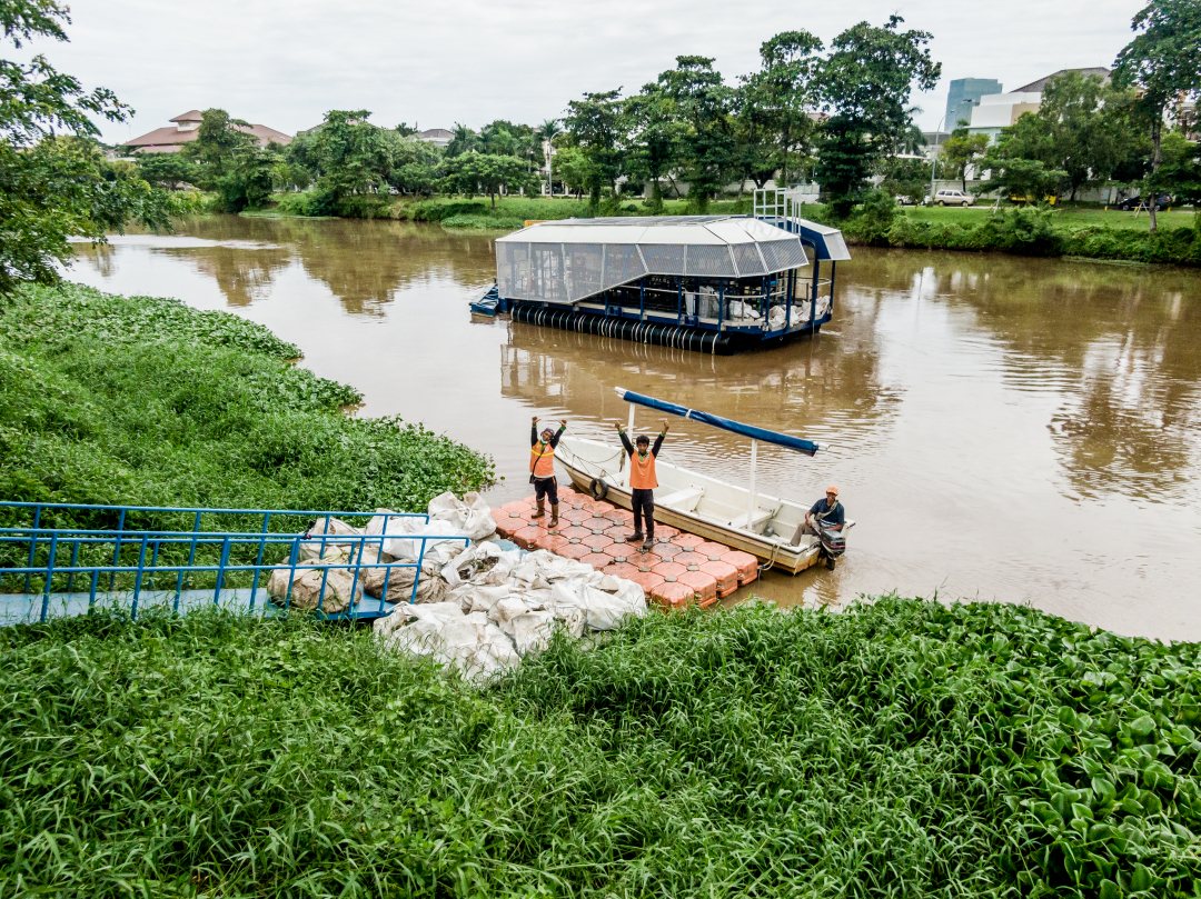 Interceptor of The Ocean Cleanup at work in Chenkareng drainage canal, Jakarta