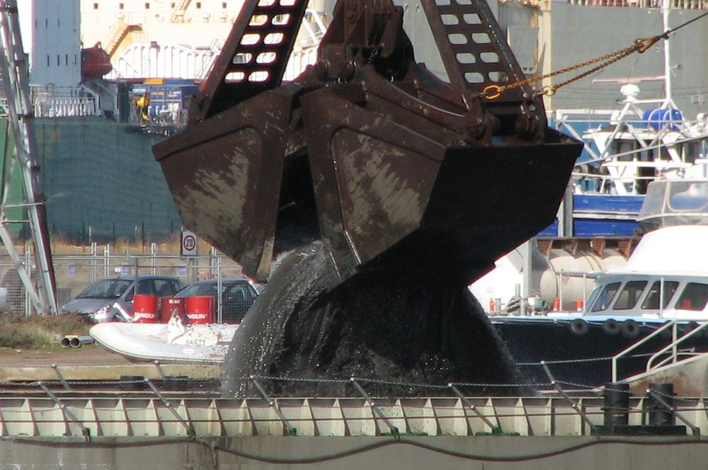 Bucket of backhoe dredger Magnor at work in port of Melbourne