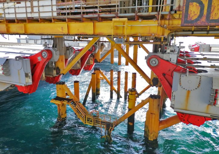 Pioneering Spirit has cut free the topside of Tyra off shore platfor loose from its (yellow) jackets
