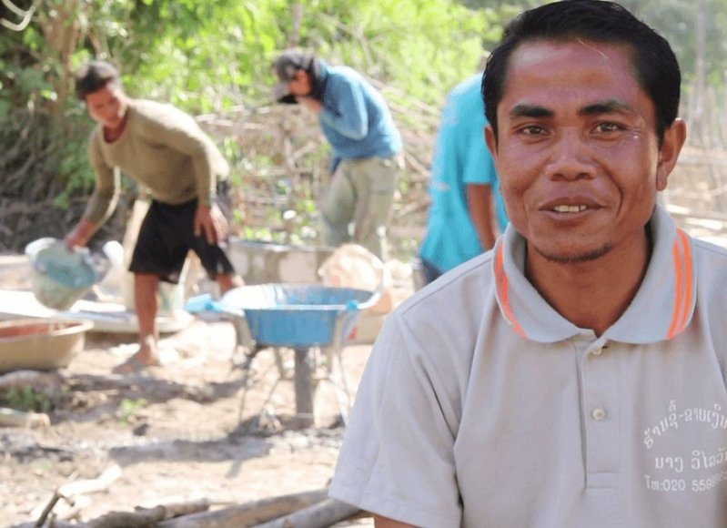 Sanitation promotor in Laos who meditates between households and toilet constructors