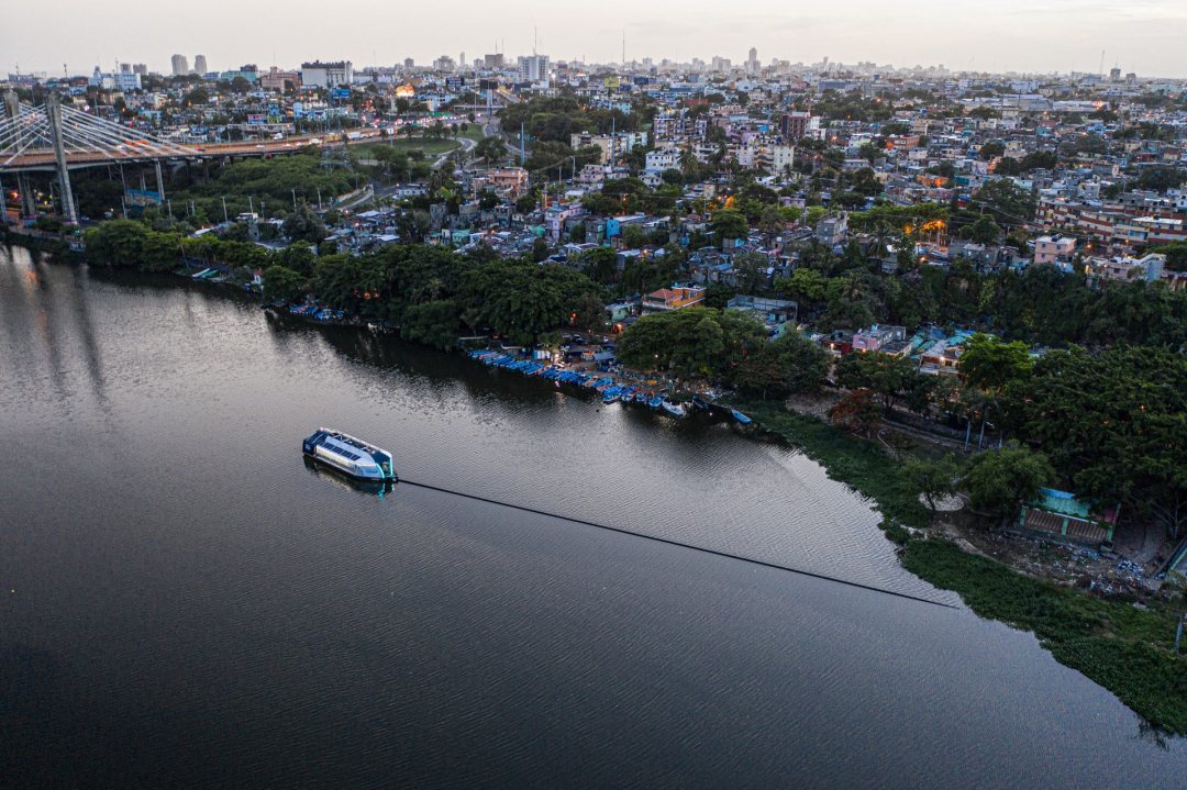 Interceptor 002 of Ocean Cleanup capturing waste on the Klang river in Malaysia