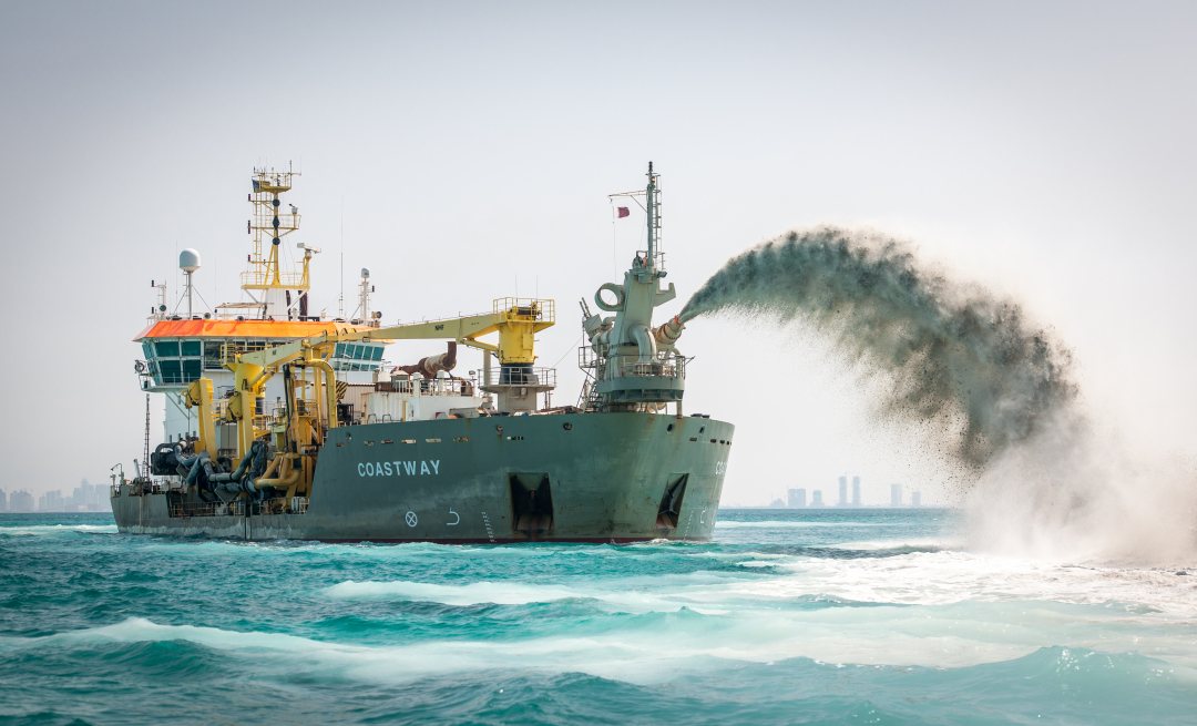 Rain bowing of sand by Boskalis for beach nourishment and land reclamation