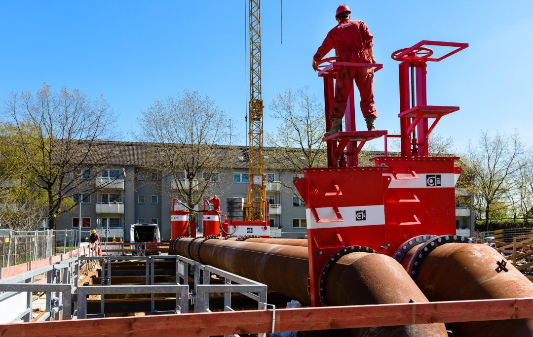 Pipe crossing to lift large water flow over construction site. Oberhausen, Germany