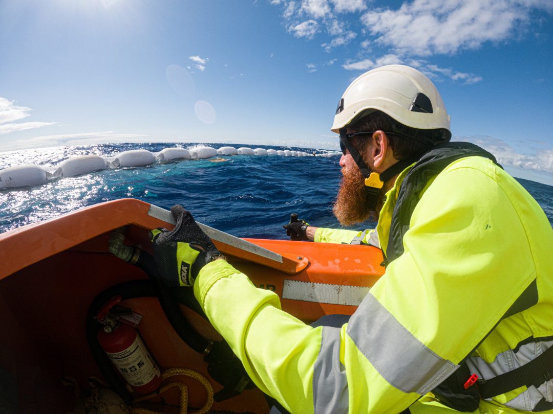 Fred Poppenk of The Ocean Cleanup inspects the collector of prototype 002 for the removal of barbage from the ocean