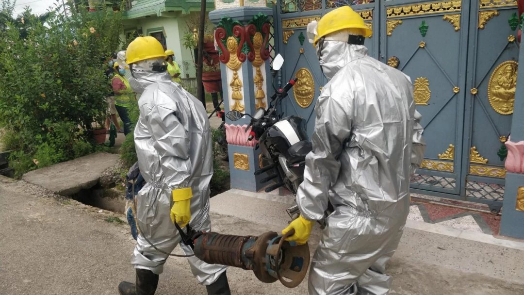 Workers that collect faecal sludge at homes in the city of Birendranagar, Nepal