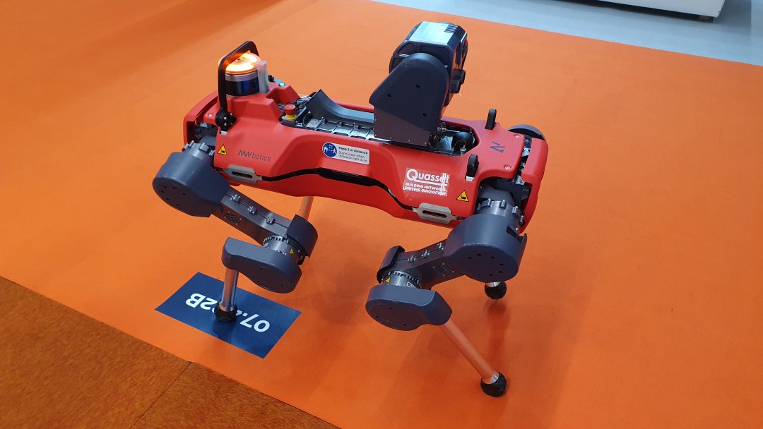 Four legged robot walking around the Netherlands Pavilion at Aquatech Amsterdam 2023.