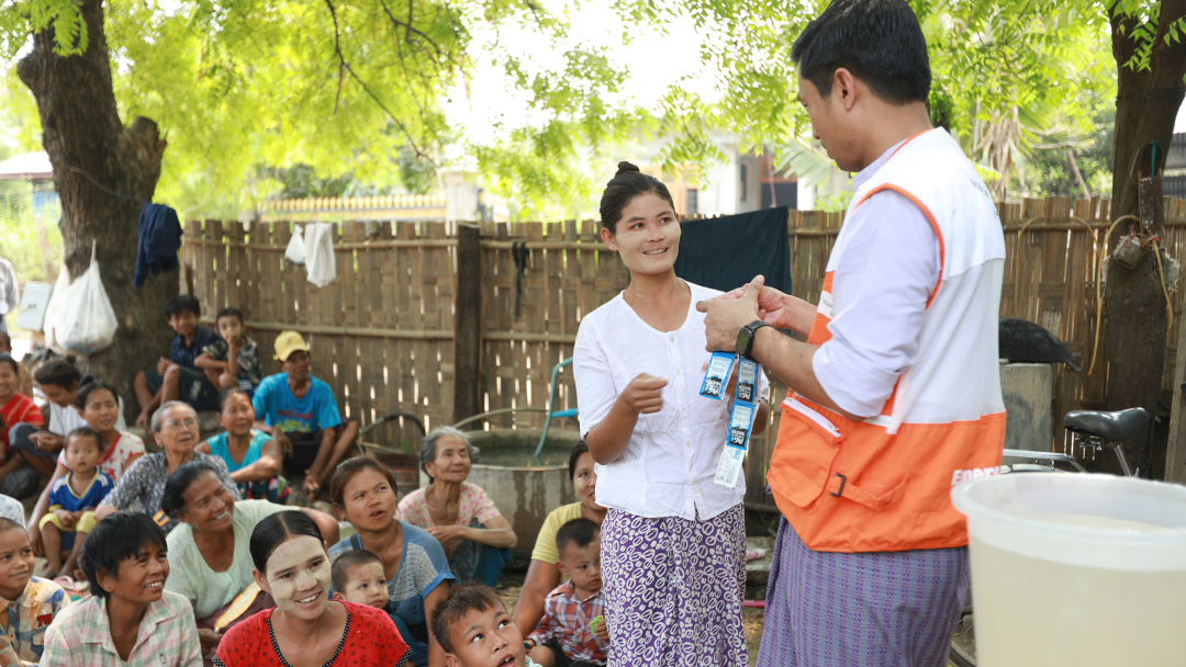 Distribution and demonstration of water purifier sachets in Myanmar. Photo: World Vision