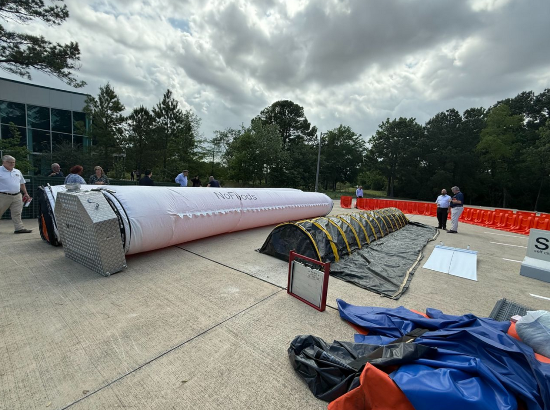 Several flood mitigation systems in action during an outdoor demonstration