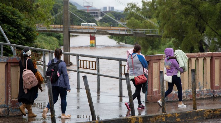 Four women walking in Tegucigalpa, with Eta storm approaching