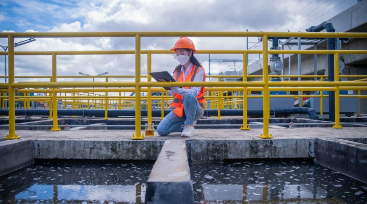 Women taking measurements at a wastewater facility.