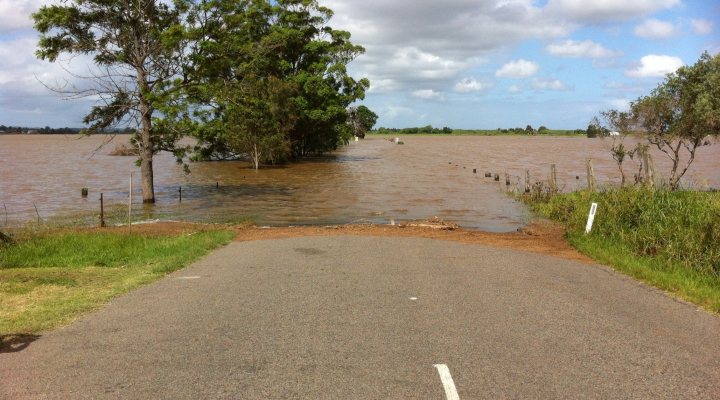 Flooding blocks a road.