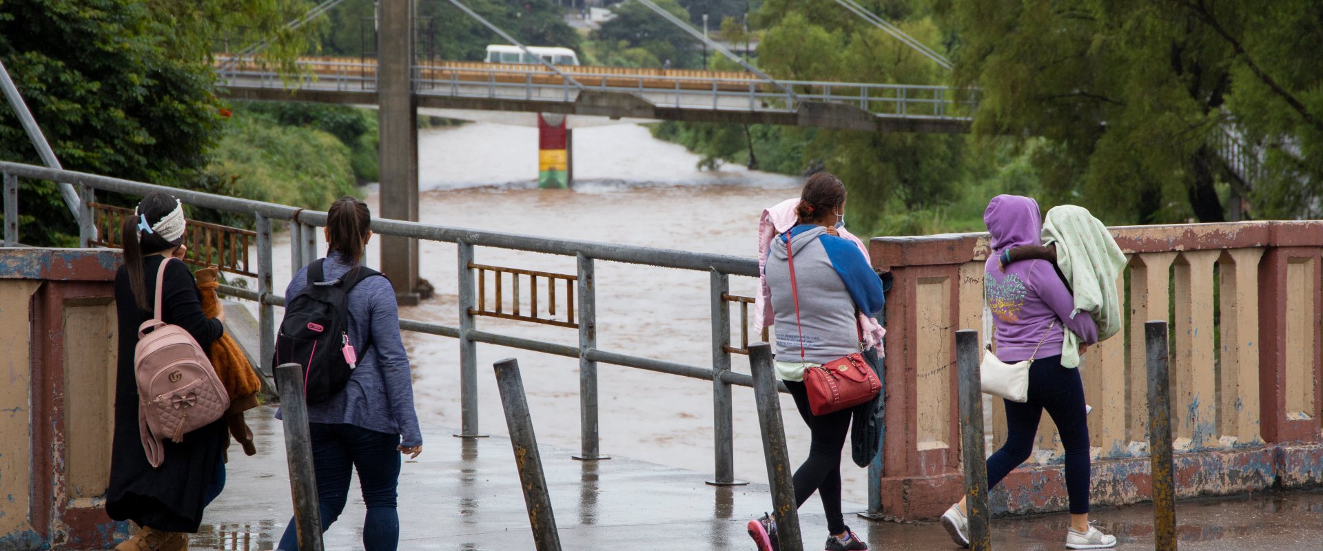 Four women walking in Tegucigalpa, with Eta storm approaching