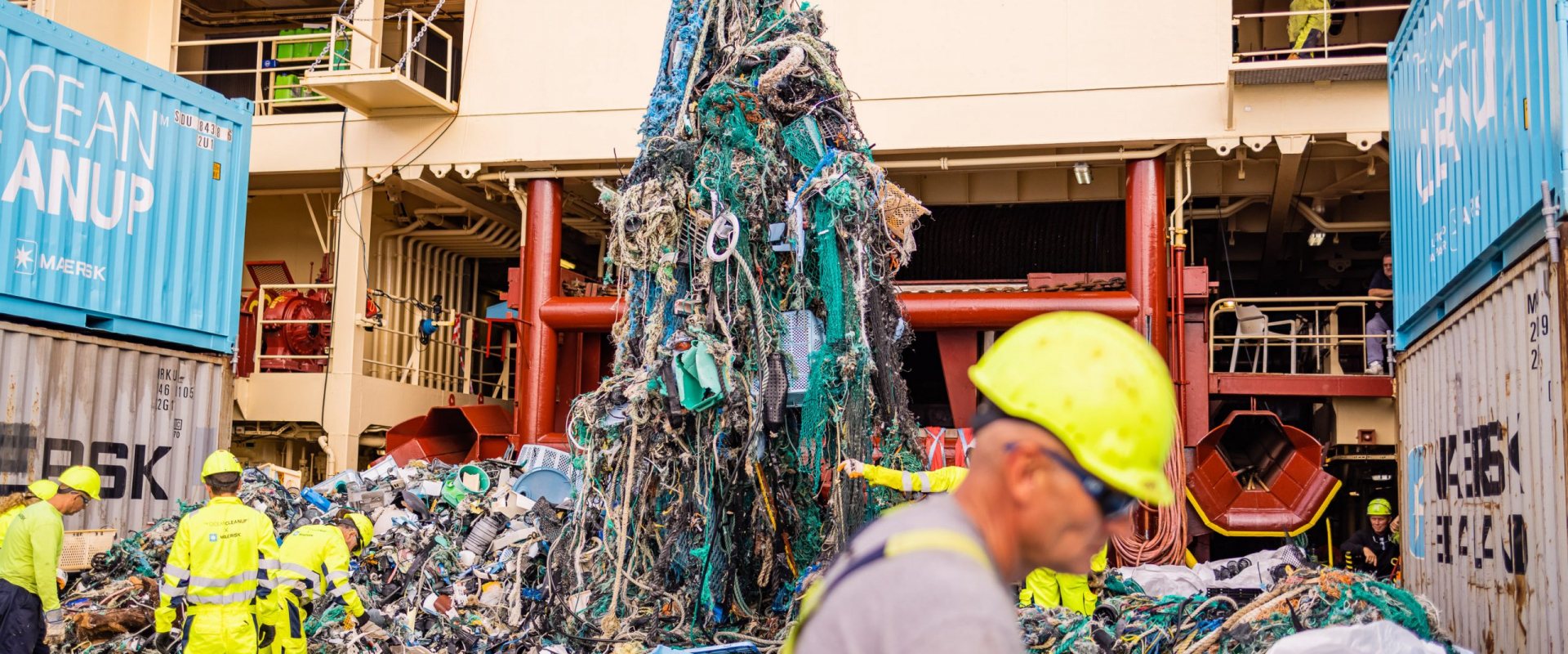 Emp-loyees of The Ocean Cleanup sort out the garbage that has been collected from the Pacific Ocean