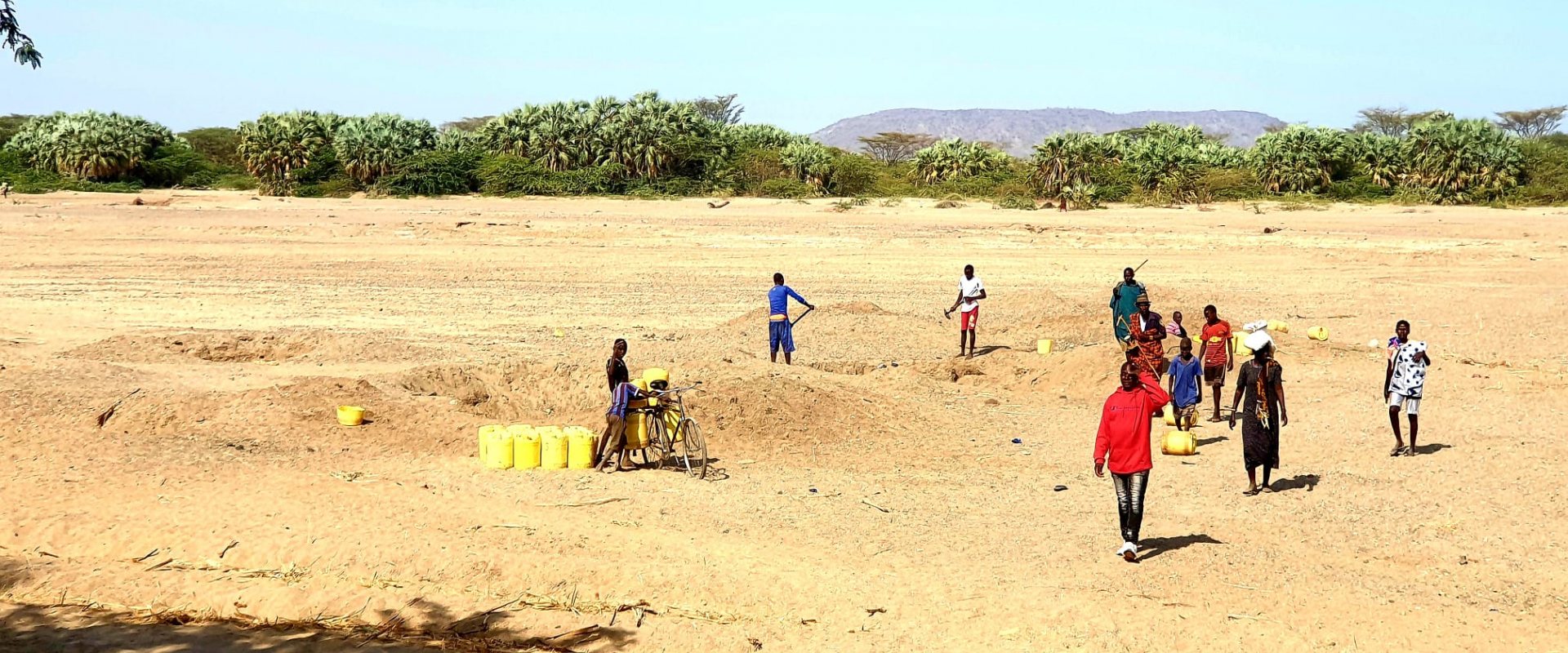 Residents in Turkana, Kenya are digging shallow wells for drinking water in a dry riverbed.