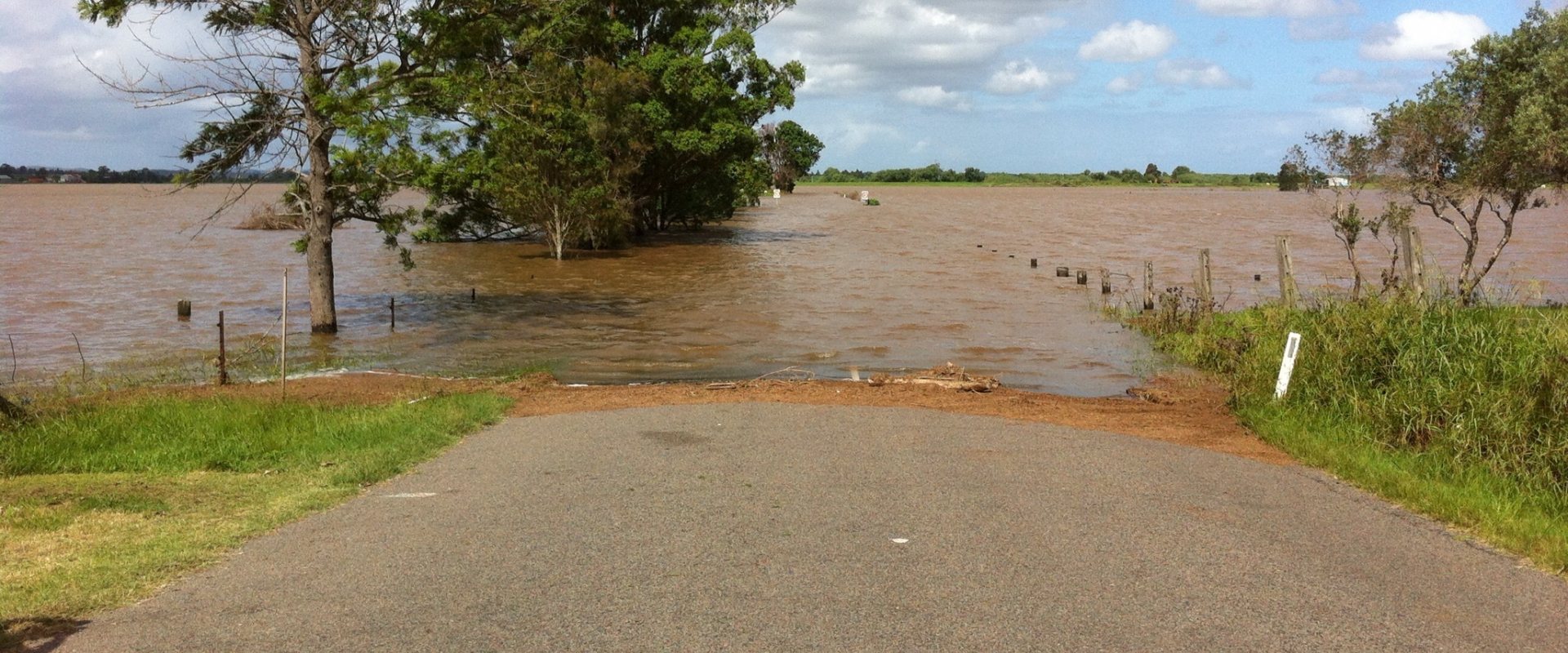 Flooding blocks a road.