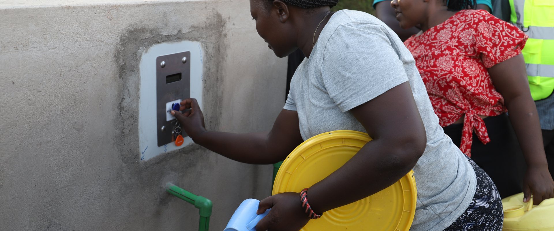 Female at a water ATM placed in Siaya County, Kenya. Photo: Dorcas